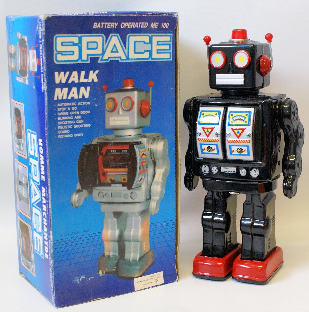 Vintage 1990's Tin Bat Op Black WALK MAN SPACE ROBOT: Vintage 1990's Tin Lithographed Battery Operated Black WALK MAN SPACE ROBOT in original box. Non-working condition. A nice shelf sitter. We have many colors available if you would like a collection of