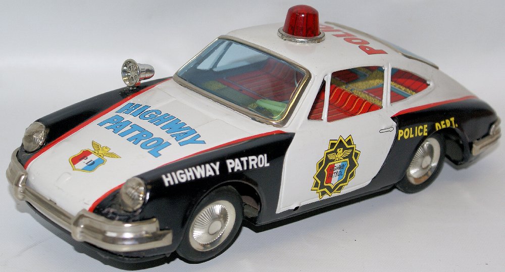 Tin LBattery Op PORSCHE POLICE HIGHWAY PATROL Car,: Vintage Tin Lithographed Battery Operated PORSCHE POLICE HIGHWAY PATROL Toy Car by Takatoku (TT), Japan. Nice bright lithography inside and out. Blue tinted windows with search light and working siren