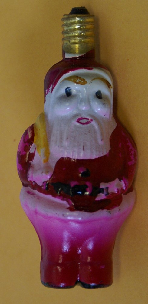 Figural Santa Claus 15V Christmas Tree Japan Light Bulb: Rare vintage glass figural Santa Claus figure Christmas tree light bulb. Made in Japan. 15 volt. Santa figure is painted with nice bright colors and is carrying a toy sack on his back. No cracks or ch