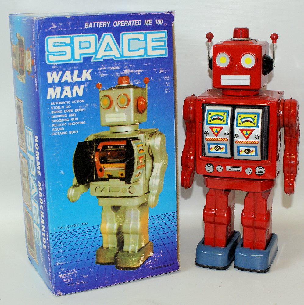 1990's Tin Bat Op Red WALK MAN SPACE ROBOT in Box: Vintage 1990's Tin Lithographed Battery Operated Red WALK MAN SPACE ROBOT in original box. Non-working condition. A nice shelf sitter. We have many colors available if you would like a collection of t