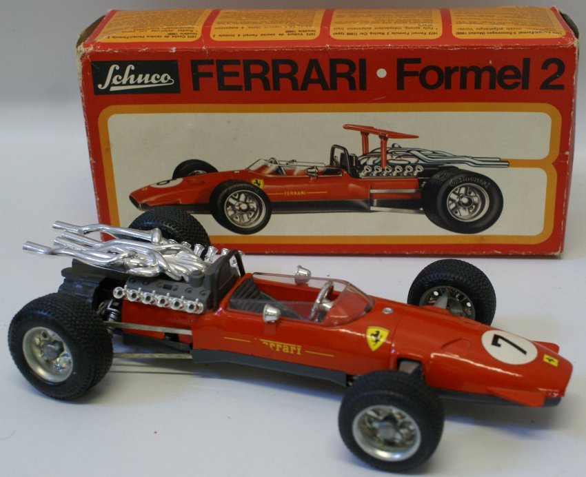 Windup SCHUCO 1073 FERRARI Formel Formula 2 Race Car: Here we have a real beauty!...a vintage wind up SCHUCO 1073 FERRARI Formel Formula 2 racing car with the original box. 1:16 scale racer. Features fully sprung independent suspension front wheels, tele