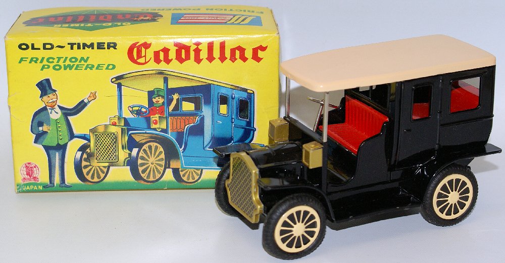 Vintage Tin Lithographed Friction S-1300 OLD-TIMER: Vintage Tin Lithographed Friction Powered #S-1300 OLD-TIMER CADILLAC by Shioji (SSS), Japan. Friction works nicely! Nice bright colors. Car measures 6" long and comes in mint condition in the original