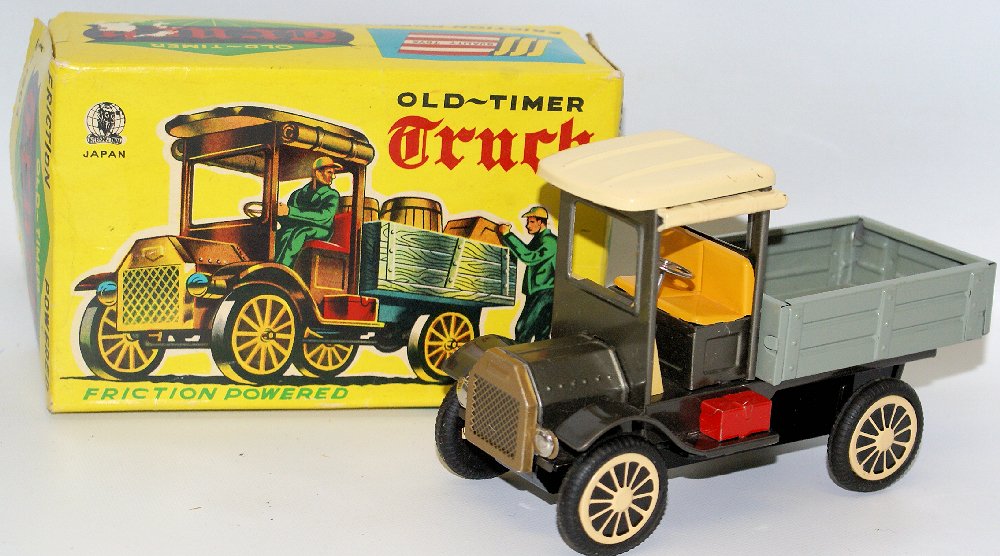 Vintage Tin Powered Old-Timer Toy Delivery Truck S-1303: Vintage Tin Lithographed Friction Powered Old-Timer Toy Delivery Truck #S-1303 by Shioji (SSS), Japan. Friction works nicely. Beautiful bright colors. A few very light surface paint nicks on roof othe