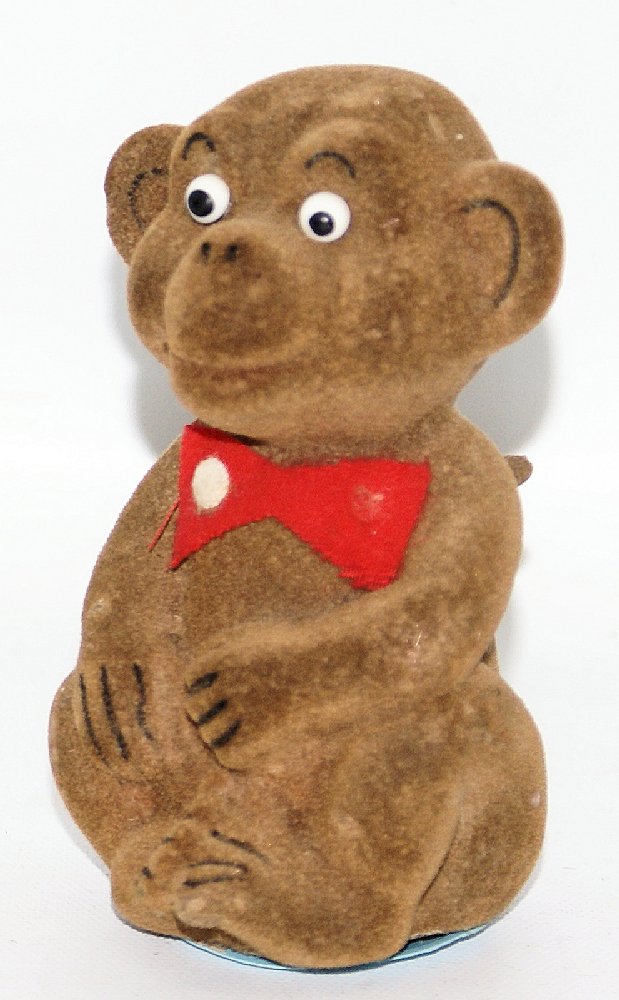 Vintage Mechanical Wind-up FLOCKED MONKEY that Shakes: Vintage Mechanical Wind-up FLOCKED MONKEY that Shakes and Spins. Nice working condition. When wound, the cute little monkey with a red bowtie spins around and and shakes. Mint condition. Measures 4-1/