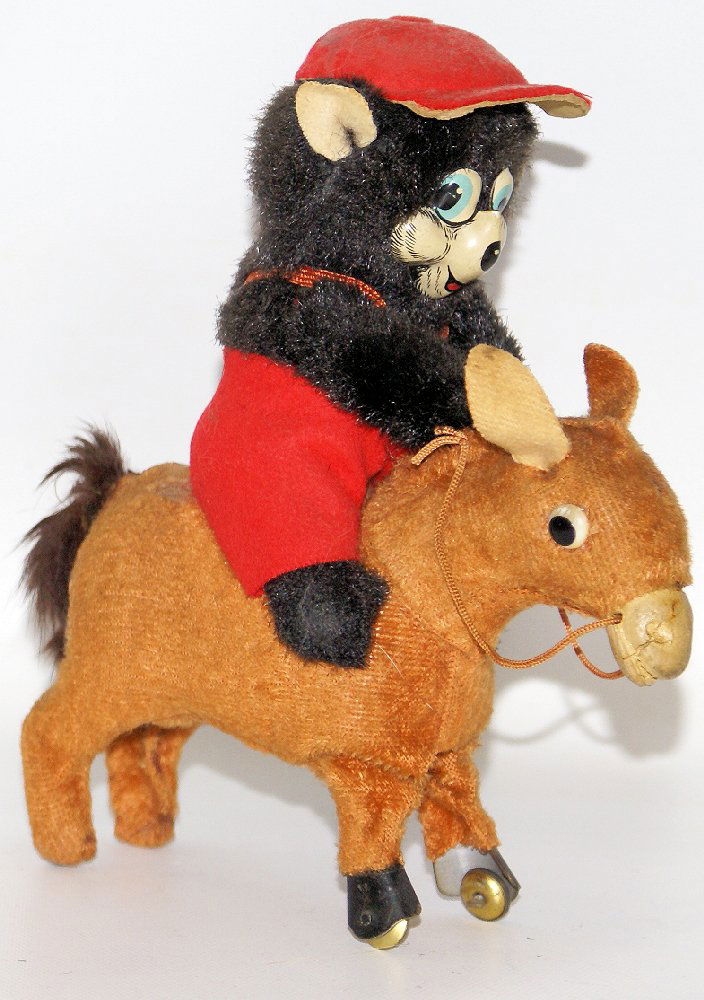Vintage Original 1950's Mechanical Wind-up BEAR RIDING: Vintage Original 1950's Mechanical Wind-up BEAR RIDING HOBBY HORSE, MM Japan. Nice working condition. When wound, the cute little horse jumps up and down, moving about. Nice early version. Measures 6-