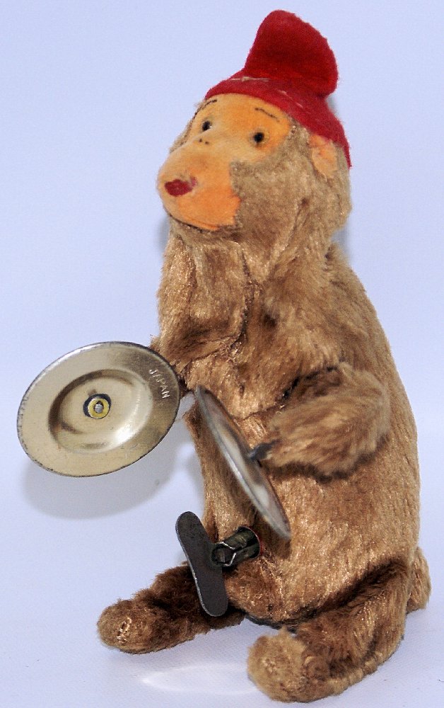Vintage Mechanical Wind-up CYMBAL PLAYING MONKEY, West: Vintage Mechanical Wind-up CYMBAL PLAYING MONKEY, West Germany. Nice working condition. When wound, the cute little fur-covered monkey with felt hat claps his hands together and plays the cymbals. Mea