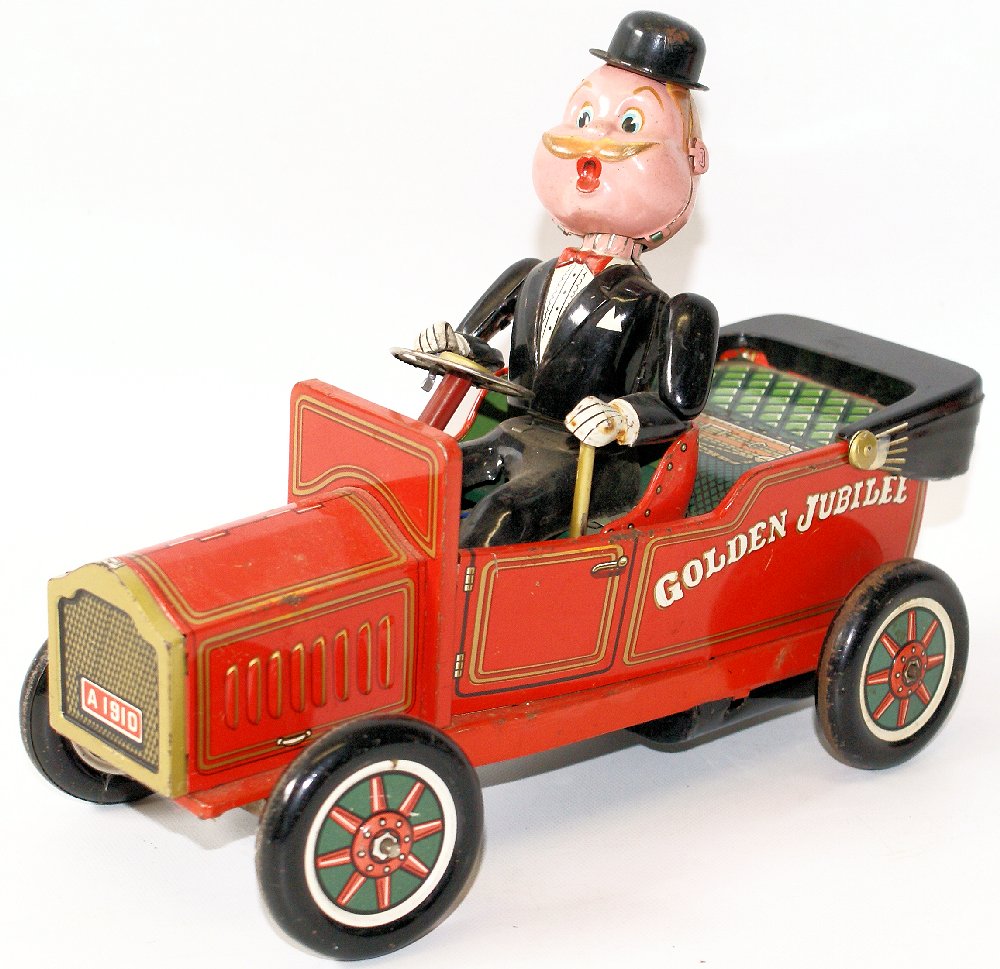 Vintage Tin GOLDEN JUBILEE 1910 Ford Shaking Classic: ULTRA RARE Vintage Tin Lithographed Battery Operated GOLDEN JUBILEE 1910 Ford Shaking Classic Car, by Nomura (TN) / Kosuge, Japan. A very cute animated character driving an old Ford. Nice working cond