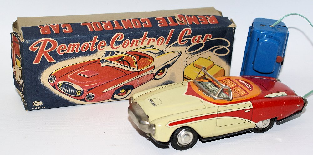 ULTRA RARE Vintage 50's DAITO (Japan) Tin Remote: ULTRA RARE Vintage 1950's Tin Lithographed Battery Operated Remote Controlled Concept Sports Car Convertible by Daito, Japan. This amazing two-seater tin litho convertible resembles a cross between a 