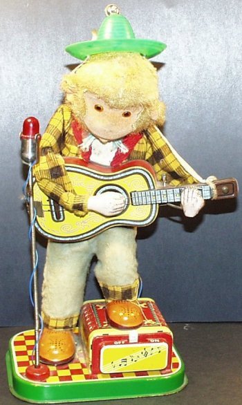 1950's Battery Operated ROCK N ROLL MONKEY Playing: Vintage 1950s Battery Operated Rock N Roll Monkey playing guitar. Made in Japan by Alps, and imported by Rosko Toys. This is one of the more desirable battery operated character musical pieces. Perfec