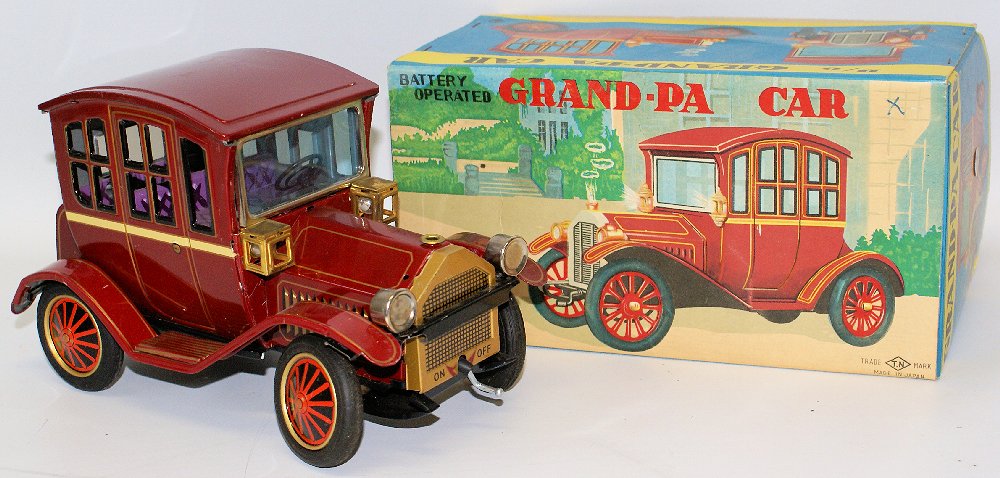 Tin B.O. Grand-pa Grandpa Toy Car by Nomura (TN), Japan: Vintage Tin Lithographed Battery Operated Grand-pa Grandpa Toy Car by Nomura (TN), Japan. Burgundy body color. Features working headlights. Clean battery compartment. Excellent condition in the origin