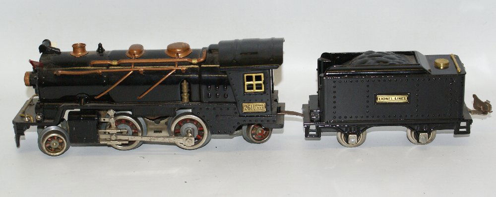 Prewar LIONEL Train O Gauge 2-4-2 261 Locomotive with: Vintage Prewar LIONEL Train O Gauge 2-4-2 261 Locomotive with Tender. Original flags. Tender, boiler and cab have been restored. Has one chipped trailing wheel. A little dusty. Overall excellent+ cond