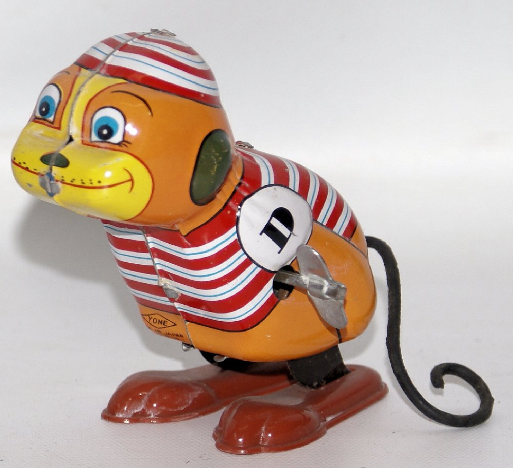 Tin Mechanical Wind-up JUMPING MONKEY by Yone, Japan: Vintage Tin Lithographed Mechanical Wind-up JUMPING MONKEY by Yone, Japan. Nice working condition. When wound, the cute little tin monkey with curly tail hops around. Measures 4" tall. Includes the or