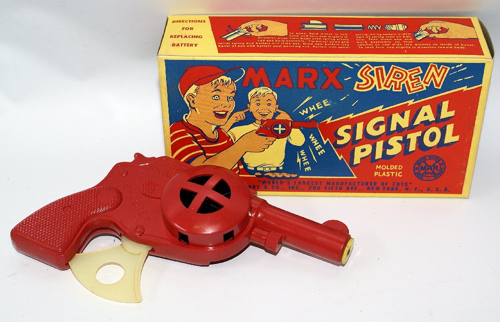 1950's MARX SIREN SIGNAL SHOOTER Molded Plastic Red: Vintage 1950's MARX SIREN SIGNAL SHOOTER Molded Plastic Battery Operated Red Pistol, by Marx. One of the more difficult to find post-war plastic hand gun toys. Absolutely MINT MINT MINT, both box and