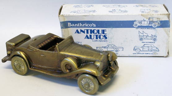 1974 BANTHRICO Metal Car Auto Coin Bank 1930 CADILLAC: Vintage 1974 BANTHRICO Metal Car Auto Coin Bank ' 1930 CADILLAC ROADSTER ' with bronze finish. Comes in the original box. Box has shelfwear. Bank is in overall excellent condition. Bank measures 7" lo