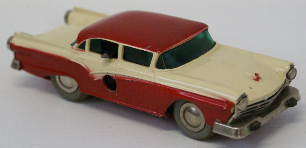 Vintage SCHUCO Wind-up MICRO RACER 1045 Ford Custom 300: Vintage Original SCHUCO Wind-up MICRO RACER 1045 Ford Custom 300 Toy Car. 2-tone cream and red body with green windows. Measures appx. 4-1/2" long and is appx. 1:40 scale. Nice working order. Some min