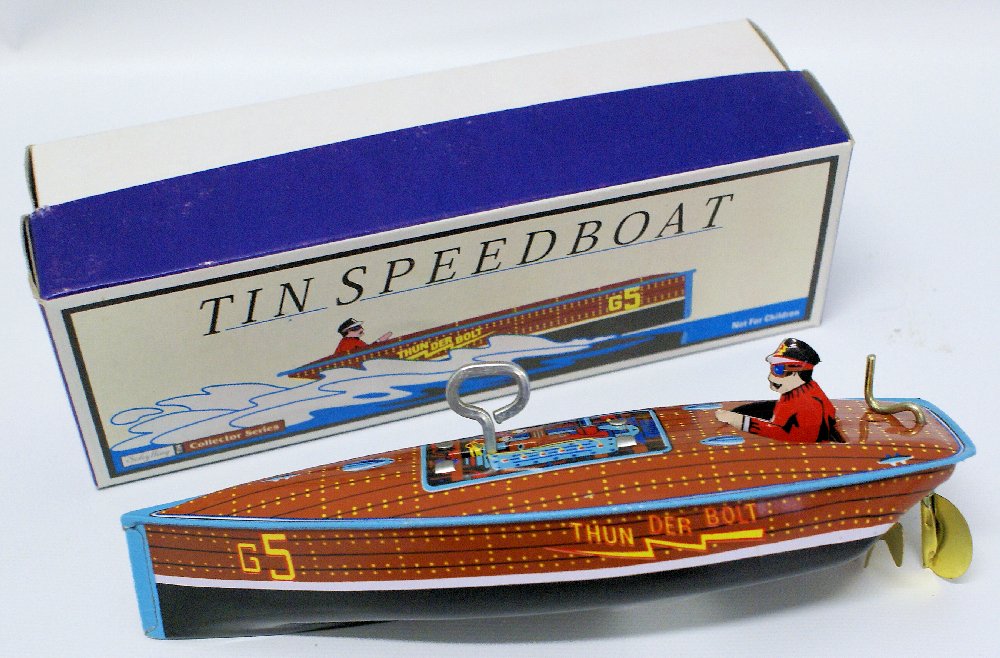Tin Windup SCHYLLING 'THUNDERBOLT' G5 Boat with Driver: Retro Reproduction Vintage Tin Lithographed Wind-up SCHYLLING 'THUNDERBOLT' G5 Boat with Driver. Comes in the original box. Measures 7" long. Old store stock.
