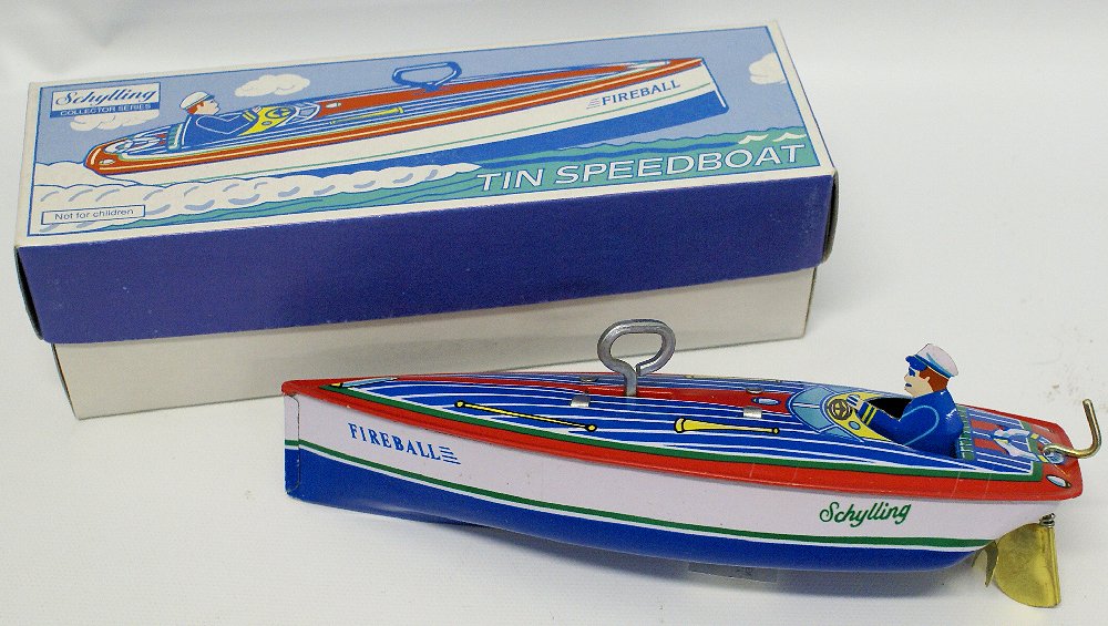 Tin Windup SCHYLLING 'ZEPHYR' Boat with Driver, in Box: Retro Reproduction Vintage Tin Lithographed Wind-up SCHYLLING 'ZEPHYR' Boat with Driver. Comes in the original box. Measures 7" long. Old store stock.