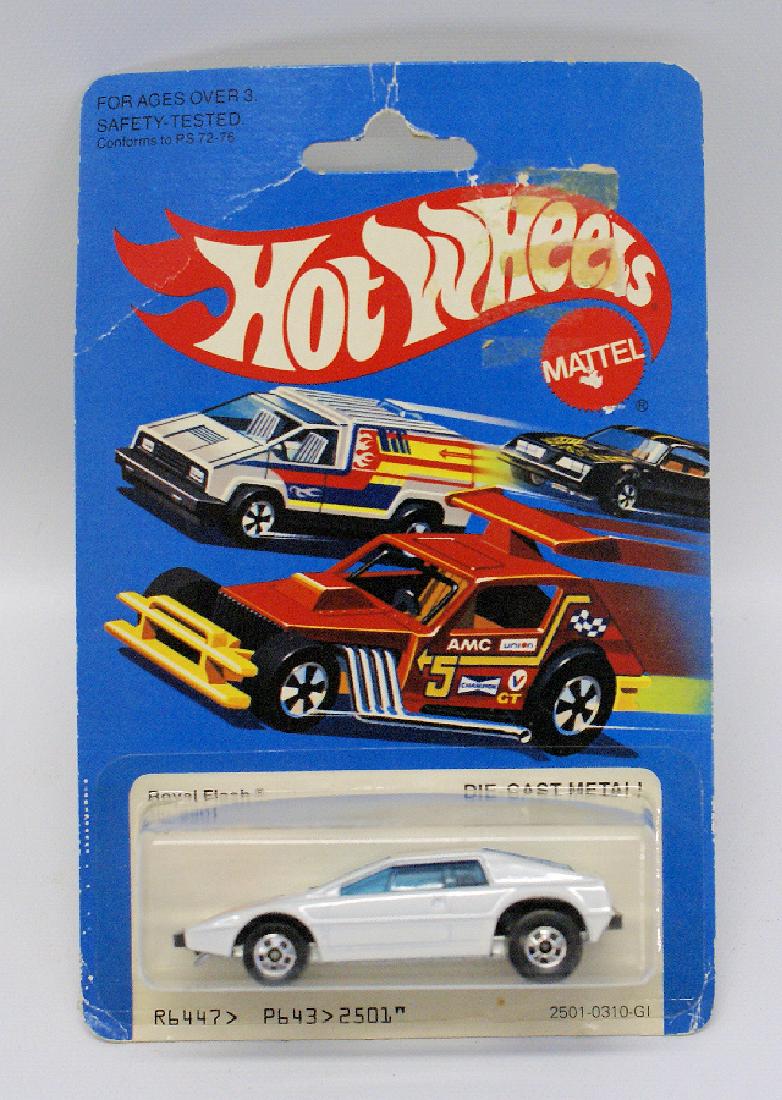1981 HOT WHEELS 1:64 Diecast #2501 White ROYAL FLASH: Vintage 1981 HOT WHEELS 1:64 Scale Diecast #2501 White ROYAL FLASH, Sealed on Card. Base is bare metal dated 1978, Malaysia. No indents on bubble. Card has some slight crease marks and glue residue fr