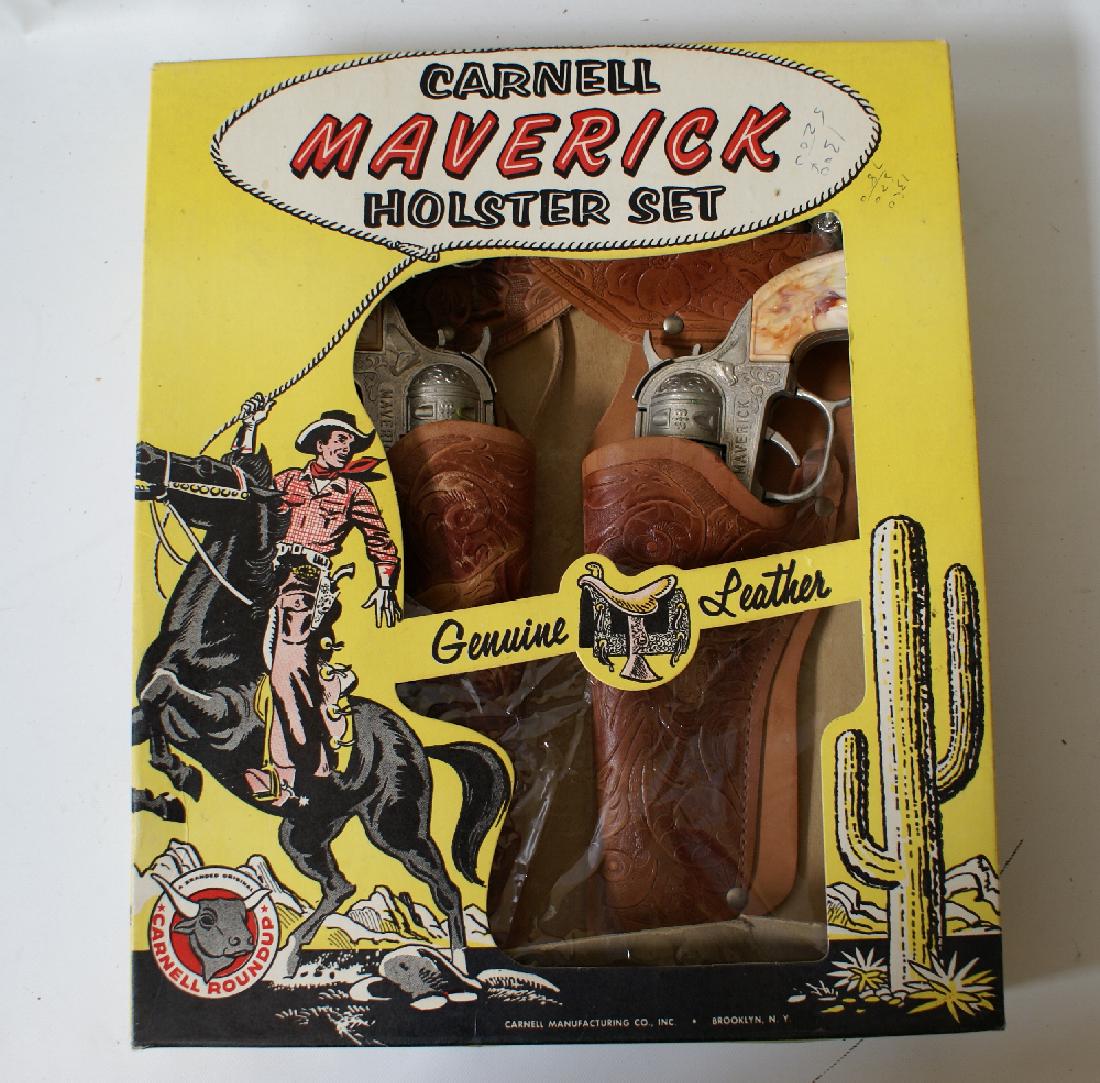 RARE Vintage CARNELL Genuine Leather MAVERICK DOUBLE: ULTRA RARE Vintage CARNELL Genuine Leather MAVERICK DOUBLE HOLSTER SET #2530. Includes (2) 9" Maverick cap guns, beautifully detailed tooled leather double holster belt, 4 plastic bullets still in the