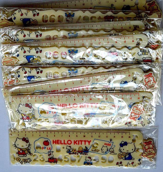 SET OF 12 HELLO KITTY RULLERS: SET OF 12 HELLO KITTY RULLERS.