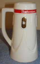 Budweiser Pottery 1965 -1967 Stein Gold A&Eagle: Budweiser Pottery 1965 - 1967. Details include a red stripe with the Budweiser logo circling the top and 4 Gold A&Eagle logos