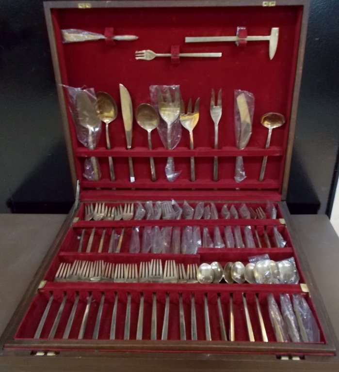 Flatware Set with Wooden Chest: Brass plated silverware set full service for 8 with 102 pieces. Set comes housed within a solid wood, red felt lined chest. Chest has a gold colored placard that reads "The La Costa Spa".