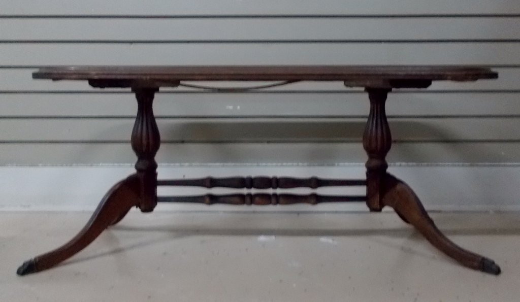 Wood & Glass Coffee Table: This coffee table is comprised of wood and glass. The table top measures 36" x 19" with a height of 16"