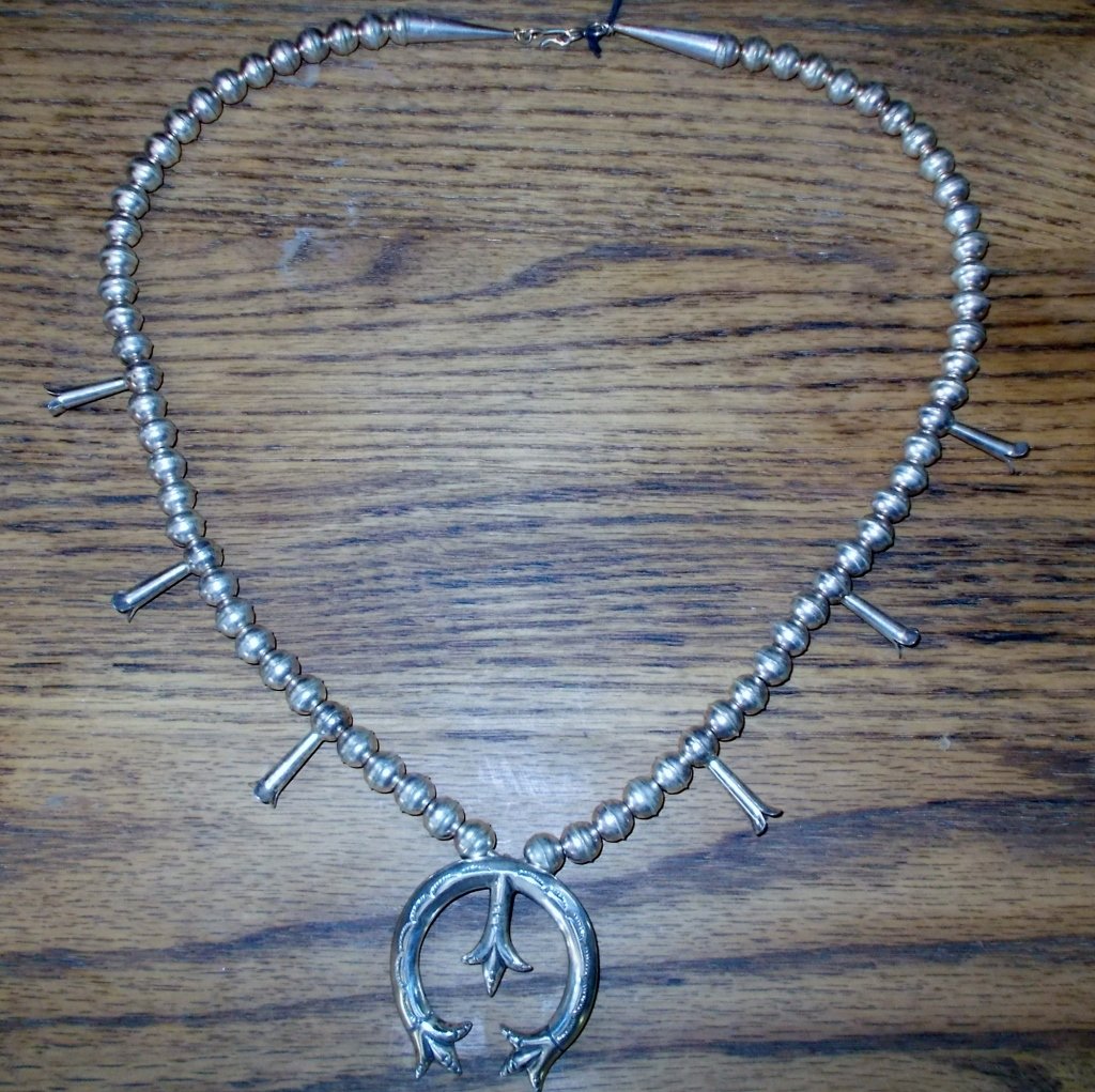 Sterling Silver Squash Blossom: This is a Sand Cast Navajo Sterling Silver Squash Blossom Necklace.