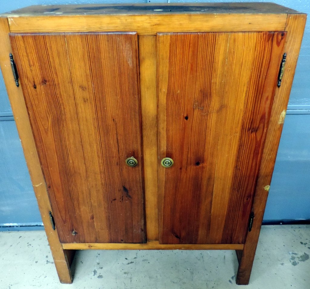 Wooden Shelf: Great solid wooden shelf. With doors that close easily on a magnetic strip hiding three wooden shelves inside.