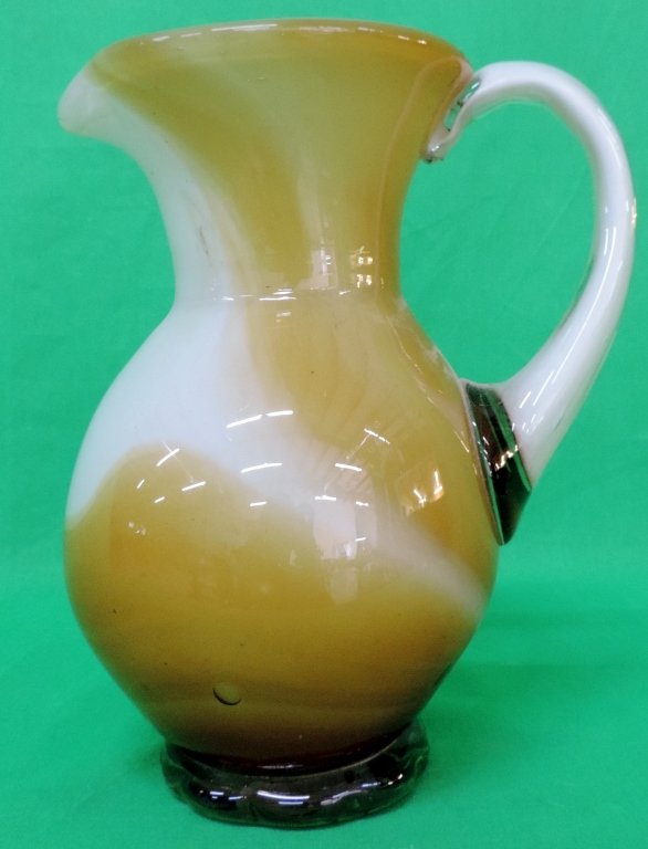 Hand Blown Glass Pitcher: Tan and Cream colored glass pitcher.