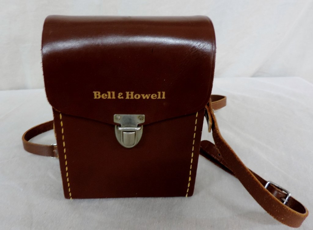 Bell & Howell Movie Camera: Bell & Howell Two Twenty 8mm Movie Camera. Camera winds up and works great also has a 8mm spool with film; however we do not know what is on the film, if anything. Camera seems to be heavy duty and we