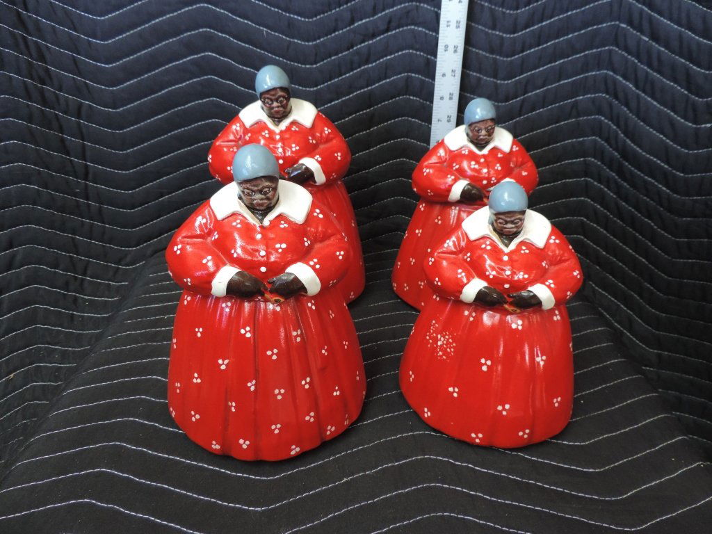 Aunt Jemima Cookie Jars: A great set of four matching vintage Black Americana Aunt Jemima cookie jars. The four jars are ladies dressed in bright red dresses with white polk-a-dots with a blue bonnet on their heads. All diffe