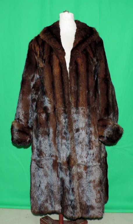 Mink Coat: Lustrous chocolate brown mink swing coat. This coat has silk0lined interior with scrolling floral stitching. There is no markings or tags to determine the size or maker. On the inside collar linen the