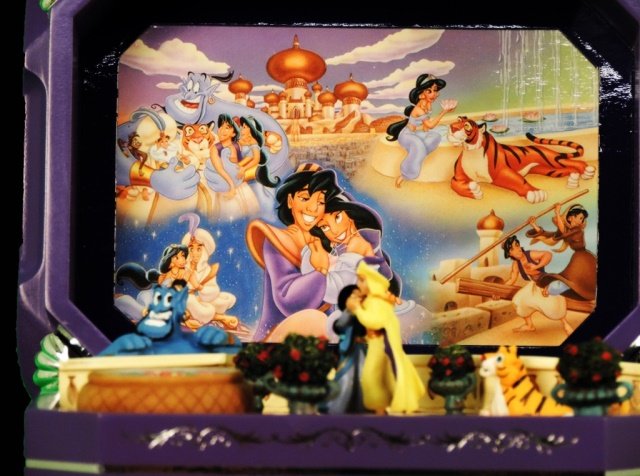 Aladdin Music box: This rare music box, made by the Bradford Exchange, is a wonderful rendition of Disney's Aladdin. It plays" A Whole New World".