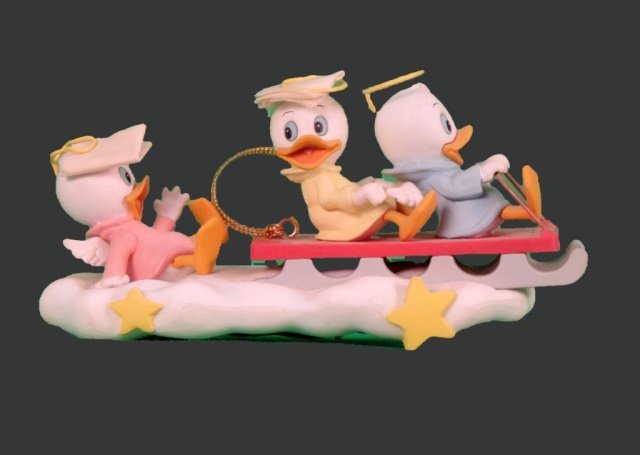 Disney's Huey, Dewey and Louie: Disney's Huey, Dewey and Louie are angels riding a sled in the clouds.