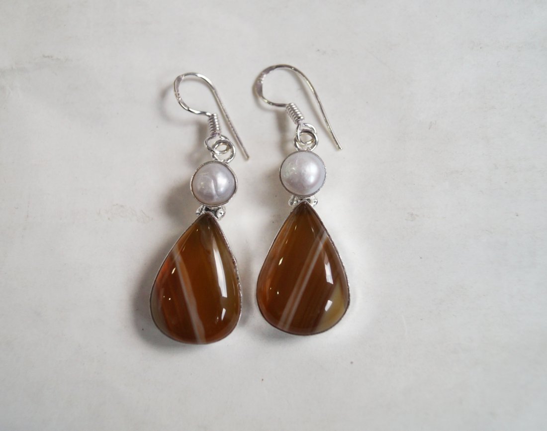 Beautiful Silver Earring with Genuine Carnelian & Pearl: Beautiful Silver Earring with Genuine Carnelian & Pearl in German Silver Alloy Weight :13 grams Length ; 1.5 Inch. Metal: German Silver Alloy Stone : Genuine Carnelian & Pearl