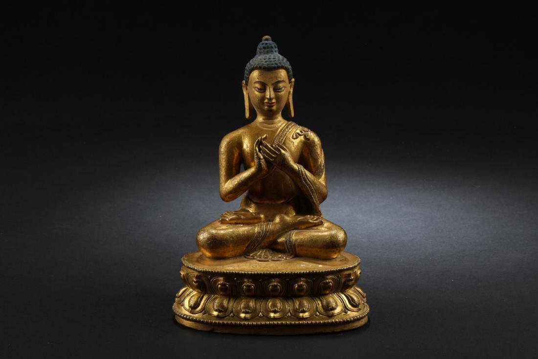 Chinese Gilt Bronze Buddha Statue: Seated in dhyanasana on doule lotus throne, the hands held in front of the lap or in mudra, wearing long flowing robe, the face with a serene expression. Height: 6 "