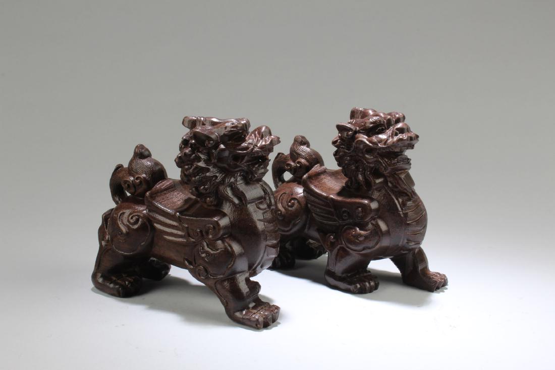 A Pair of Chinese Hardwood Carved Foo Lion Statues (1 of 4)