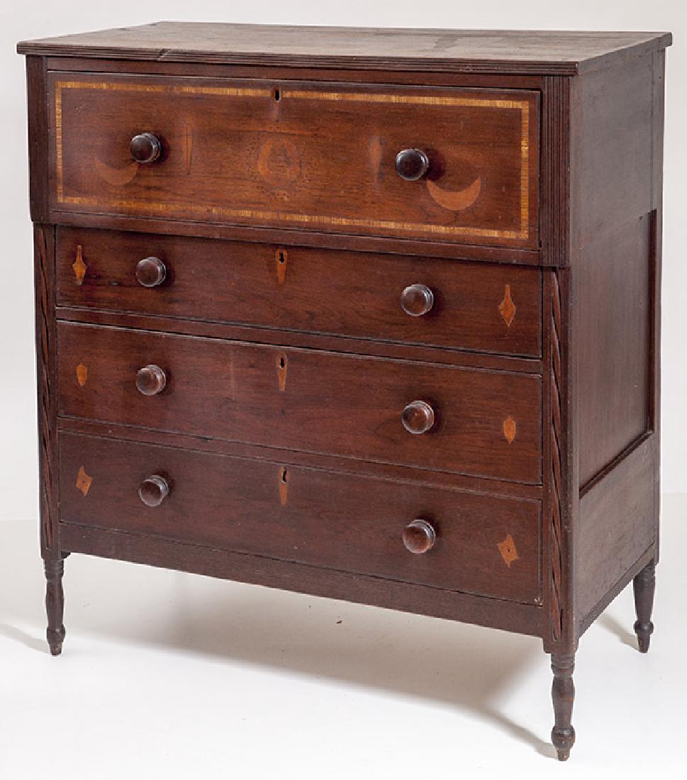 Sheraton Inlaid Chest: Circa 1820, with overhanging top with reeded front edge, over overhanging large dovetailed drawer with inlaid folksy crescent moons, coffins and geometric designs, cross banded edging, flanked by reed