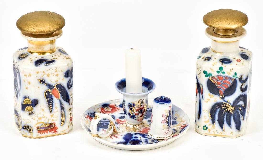 Three Pieces of Gaudy Welsh Porcelain: Including a pair of bottles with mushroom stoppers, 6 1/2" high, and a chamber stick with snuffer, 5 3/4" diameter x 3" high, all circa 1840.