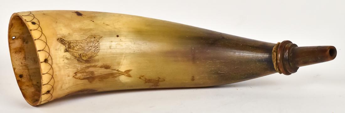 Scrimshaw Carved Powder Horn: Circa 1st quarter of the 19th century with body having two different fish, five different types of birds including turkey and leaping stag, carved spout and geometric carving at plug end, nice old pat