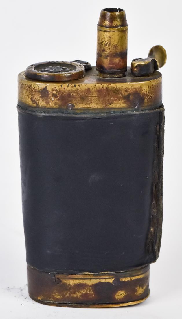 Dixon Revolver Shot Flask: Brass with original black leather wrap, marked on lid J. Dixon & Sons Sheffield, 3" high.