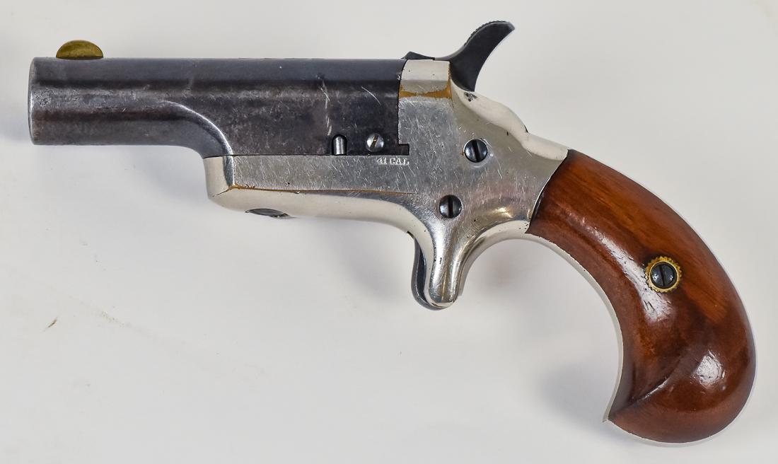Colt #3 Derringer 41 Cal Derringer: Single shot pistol with side piviting and blued 2 1/2" round barrel marked COLT on top with standing brass front sight, nickle plated steel frame, marked on left side 41 Cal, two piece walnut grip, 5"