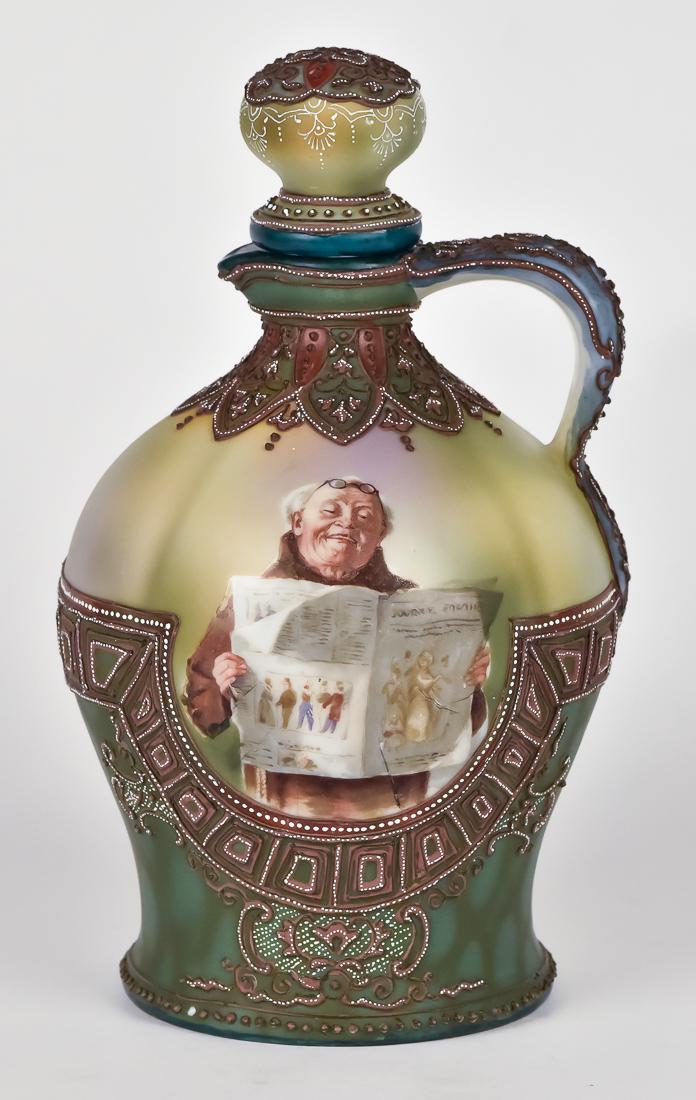 Moriage Nippon Wine Jug with Monk: Wonderful wine jug with stopper and heavy moriage decoration. Scene with monk reading newspaper. Green Maple Leaf mark. 9 1/2" high. Tiny flaw at newspaper bottom edge and minus one bead, otherwise fi