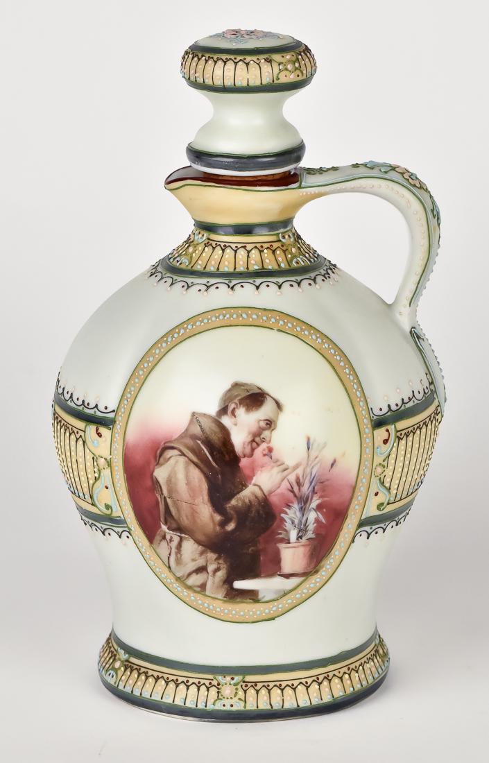 Scarce Nippon Wine Jug with Monk Scene: Fine jug with oval panel of monk smelling flowers and nice moriage decoration. Maple Leaf mark. 9 1/2" high. Fine condition