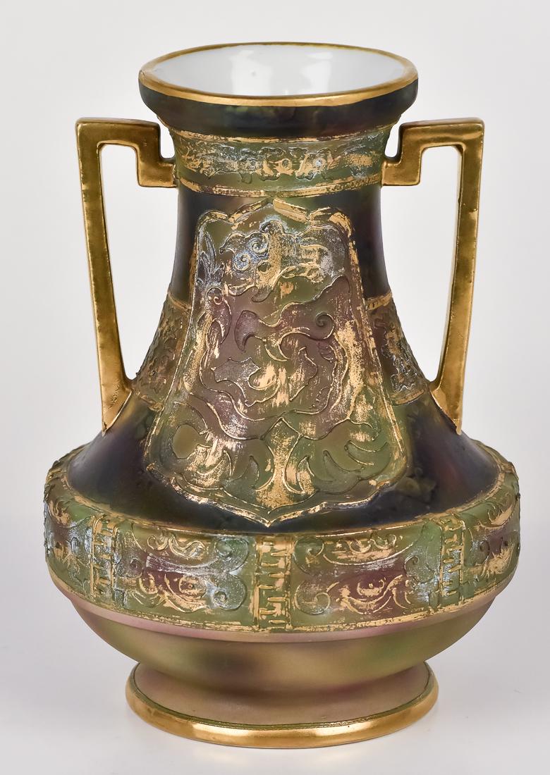 Nippon Vase with Unusual Design: Double handled with heavy enamel and oil spot background. M in wreath mark. 8 " high. Fine condition.