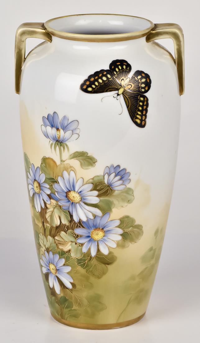Nippon Vase with Florals and Butterfly: Double handled. M in wreath mark. 10" high. Fine condition.