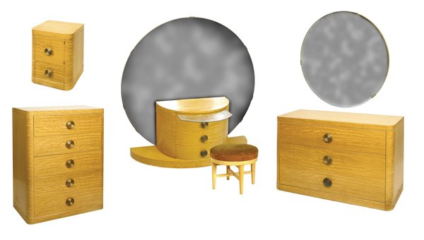 GILBERT ROHDE STYLE BEEDROOM SUITE: Great Art Deco bedroom suite. Blonde mahogany. Set includes 63" h. x 62" w. vanity with large round mirror and pull-out glass tray, 18" h. stool, 34" h. x 50" w. dresser with hanging round mirror, 50"