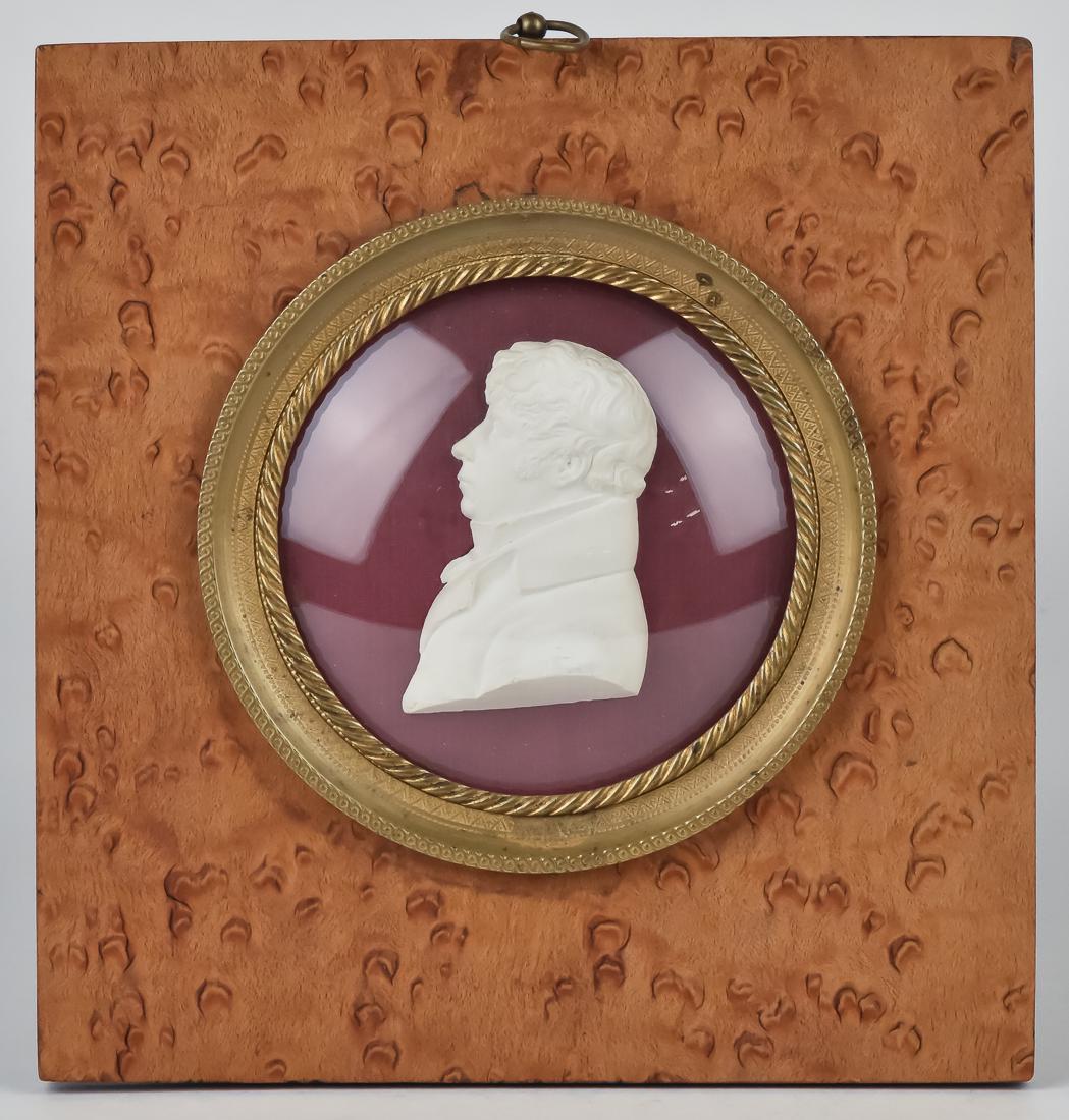1827 Relief Bust Portrait of Gentleman: Likely British artists signed S.J. and dated 1827, shoulder length profile of young gentleman in brass and birds-eye maple frame, 6 1/4" square.