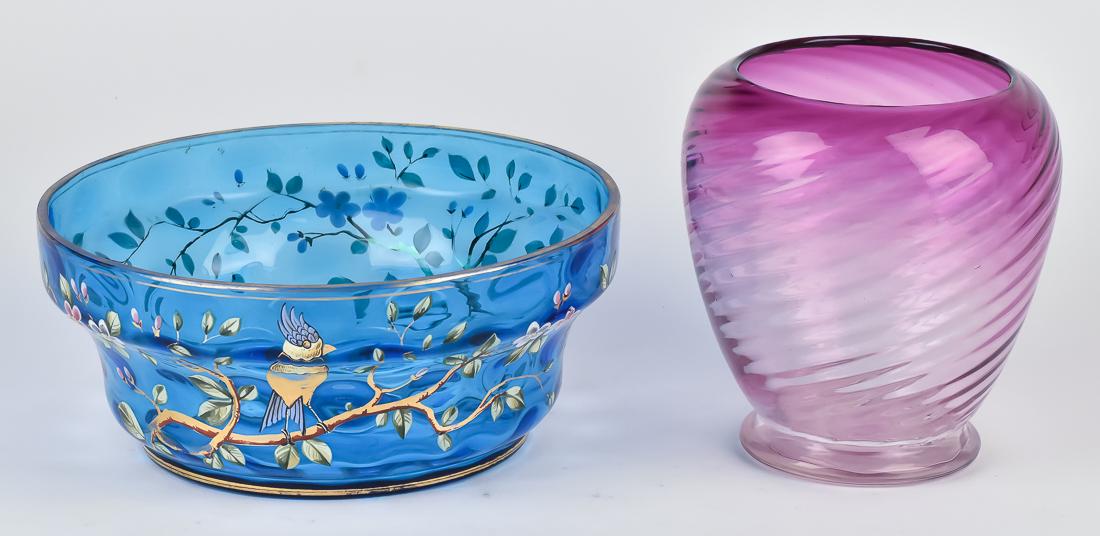 Two Peices of Victorian Art Glass: Including an enamel decorated center bowl in blue with polychrome painted floral decoration and gilt foot and lip, 9 3/4" diameter x 4 1/4" high; and purple amberina like blow footed vase with swirled
